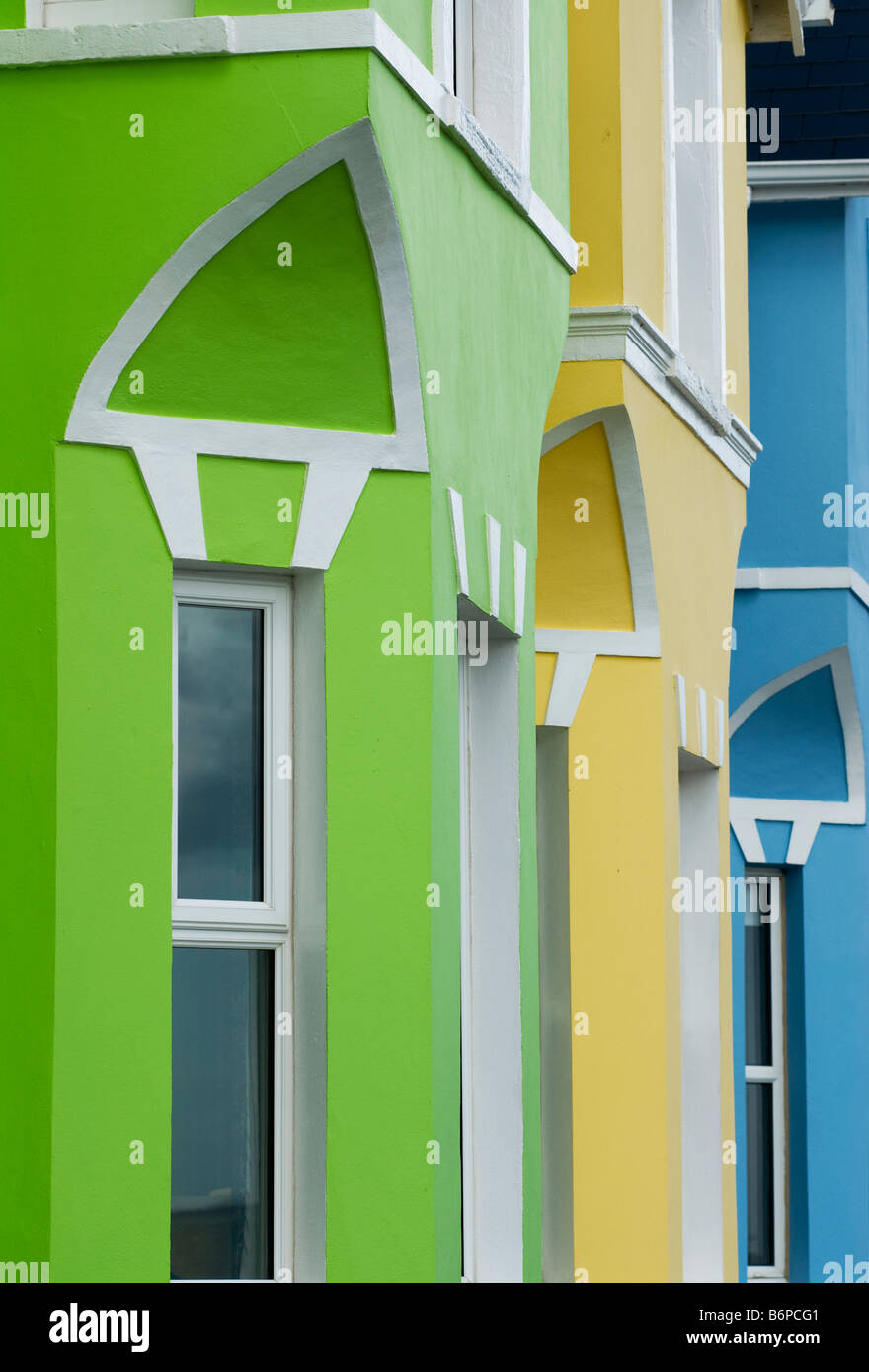 Brightly painted houses on Whitehead promenade County Antrim. Stock Photo