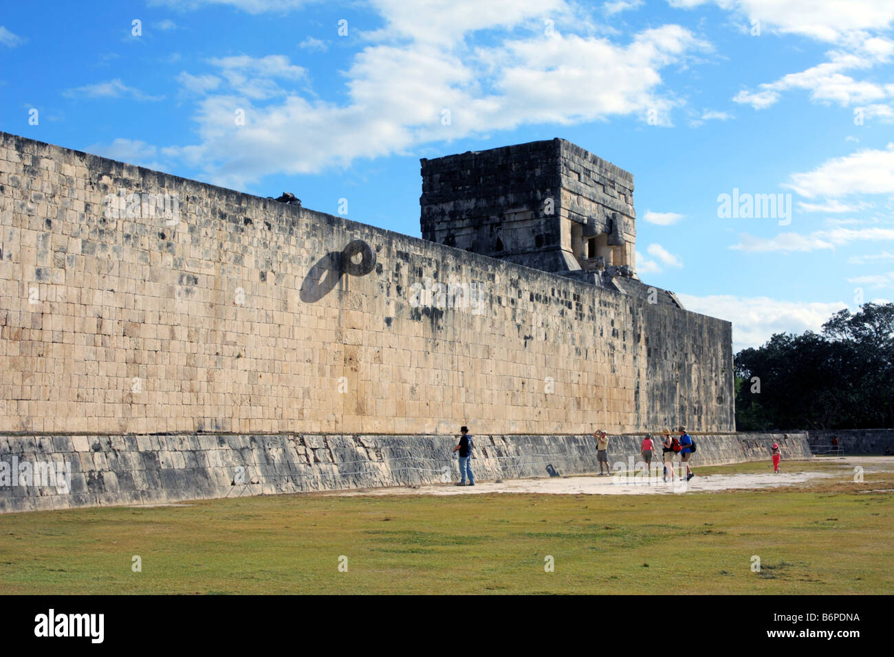 Ball Court at Chichen Itza with tourists Stock Photo