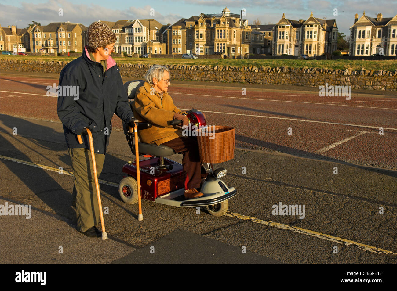 Elderly and middle aged disabled women on winter outing Weston Super Mare North Somerset England Stock Photo