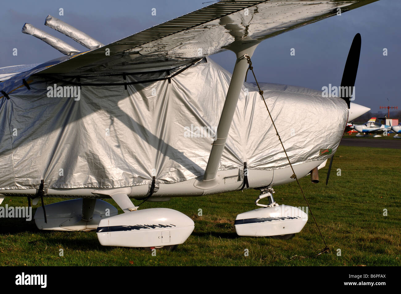 Cessna 172 aircraft with protective cover in winter, Wellesbourne