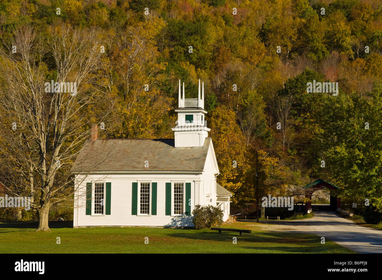 Autumn fall colours around traditional white timber clapperboard church West Arlington Vermont USA United States of America Stock Photo