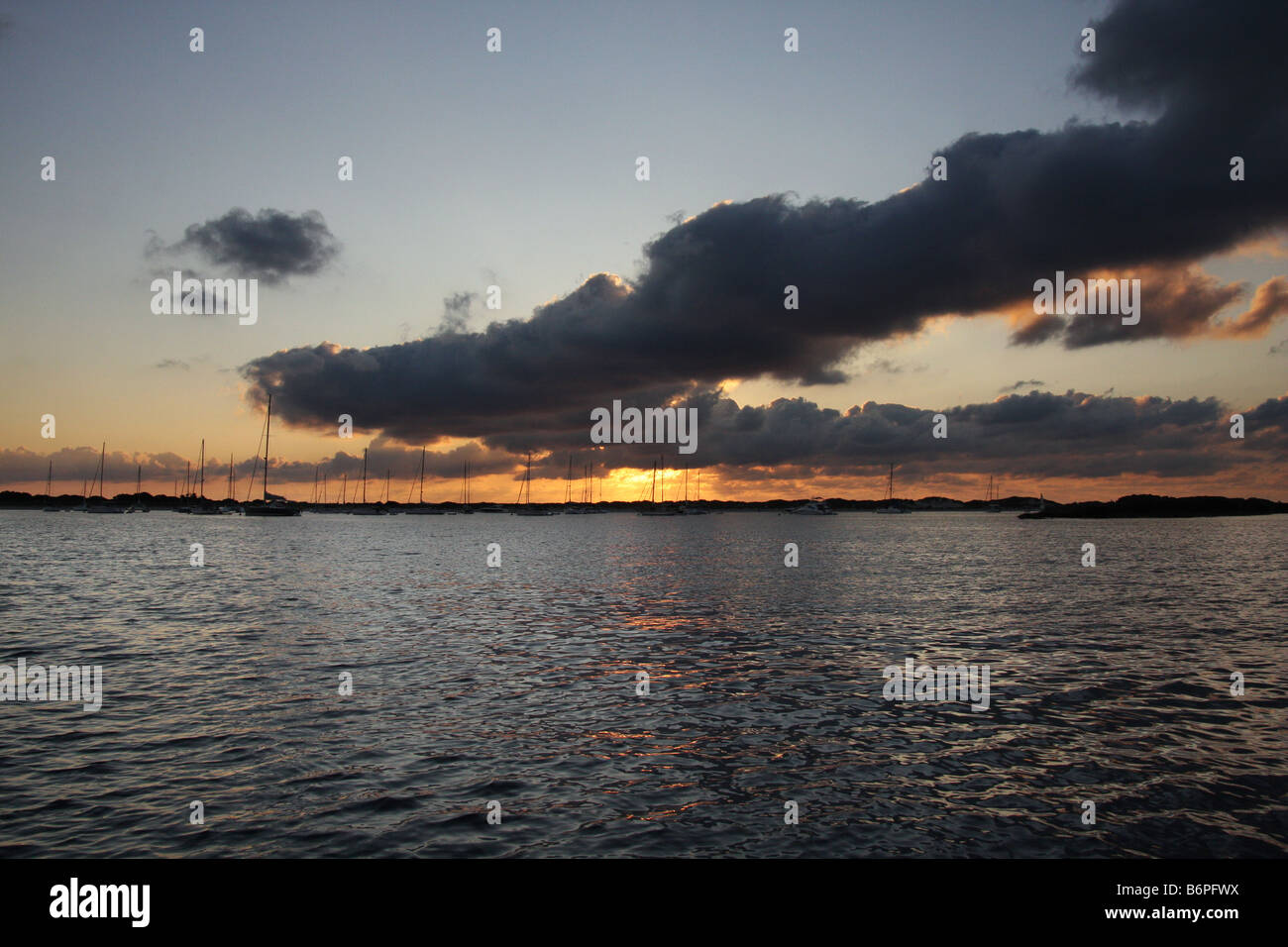Sunrise sea sun sky boats water clouds hi-res stock photography and ...