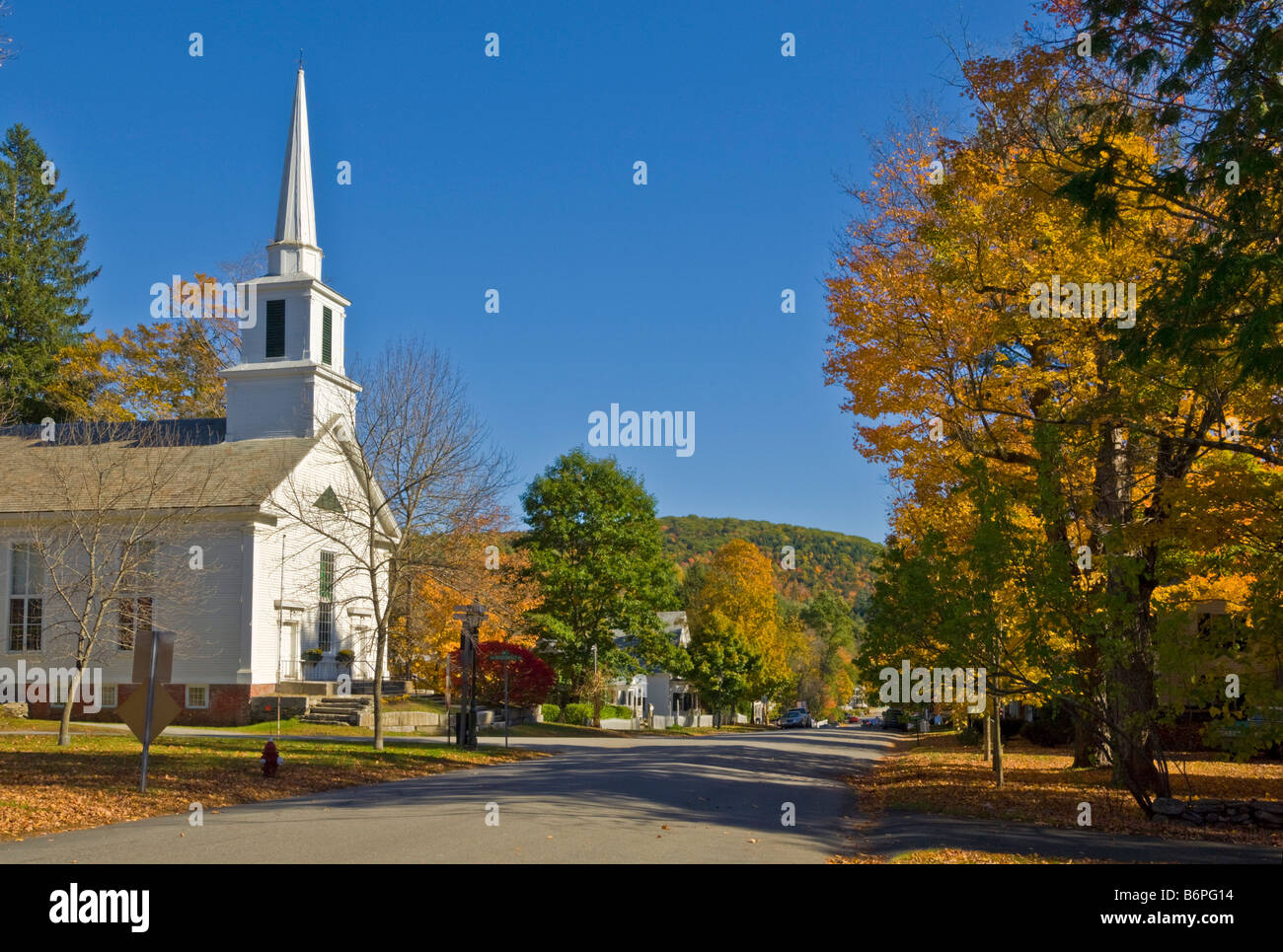 Autumn fall colours around traditional white timber clapperboard church Grafton Vermont USA United States of America Stock Photo