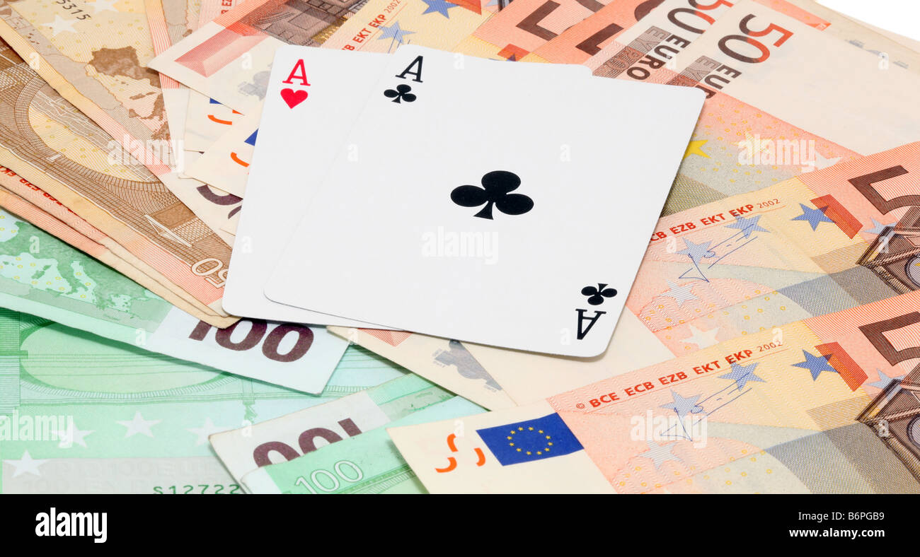 two aces gambling and money with euro banknotes background Stock Photo