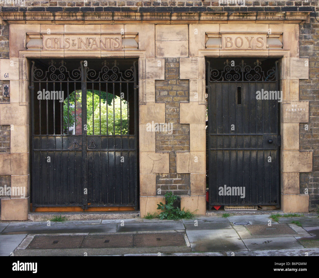 Separate entrances for boys and girls and infants to a Victorian school, London, UK Stock Photo