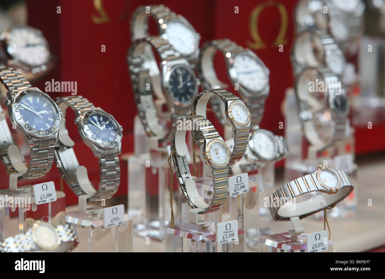 Omega watches on display in the window of an Ernest Jones store in Moorgate London Stock Photo