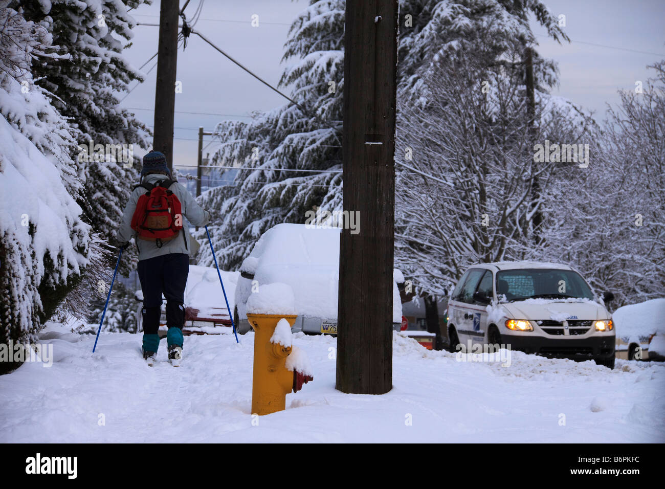 Woman using cross country skis in snow on Queen Anne Hill Seattle
