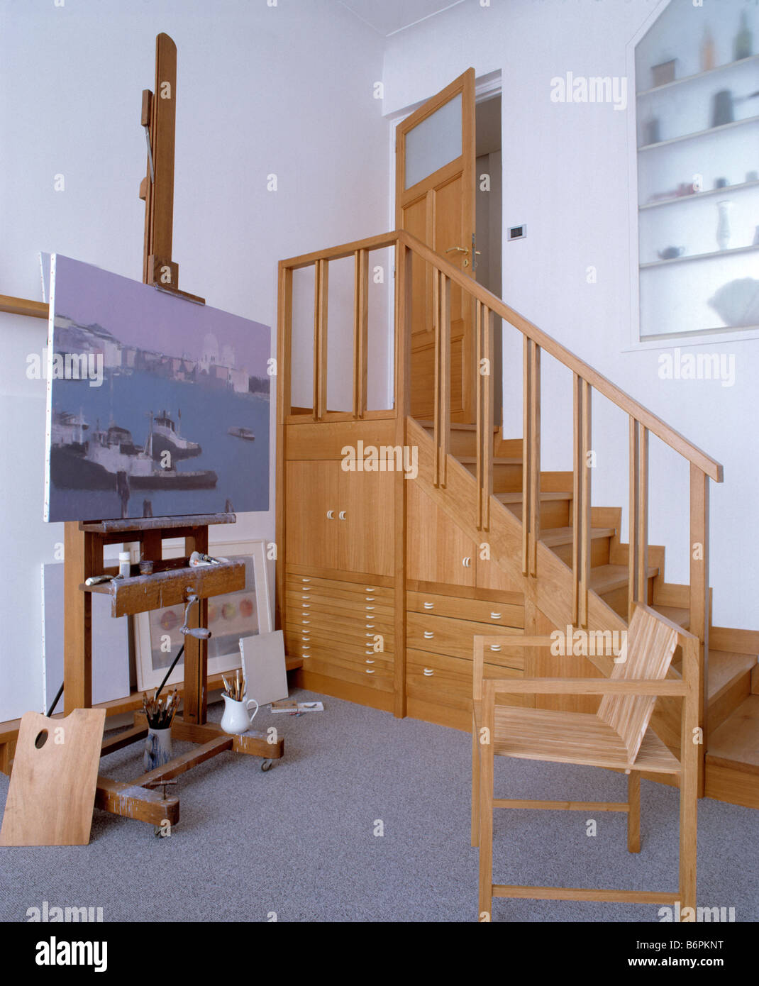 Painting On Easel In Artist S Studio With Wooden Staircase With