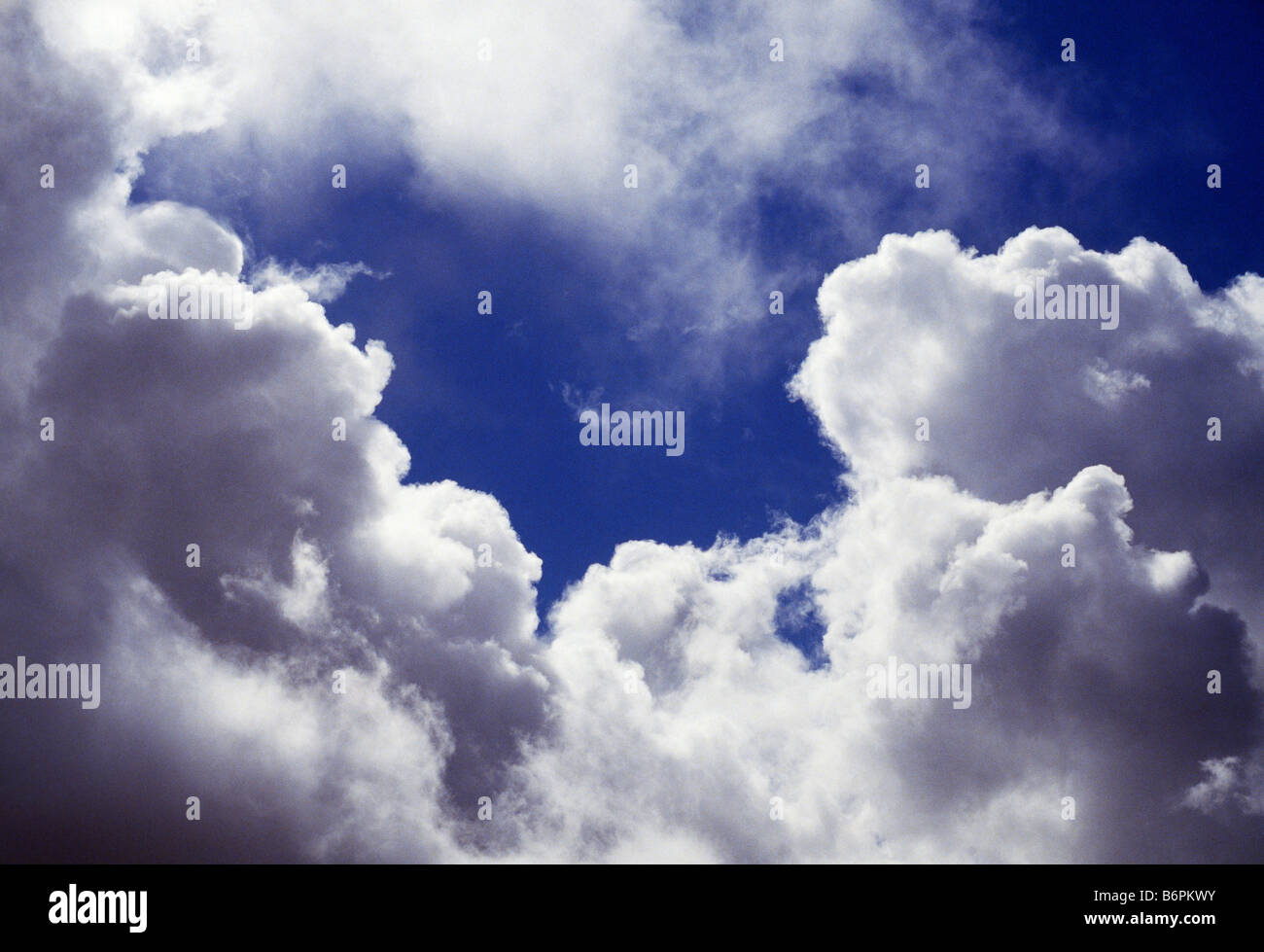 Dramatic white clouds against a blue sky Stock Photo - Alamy