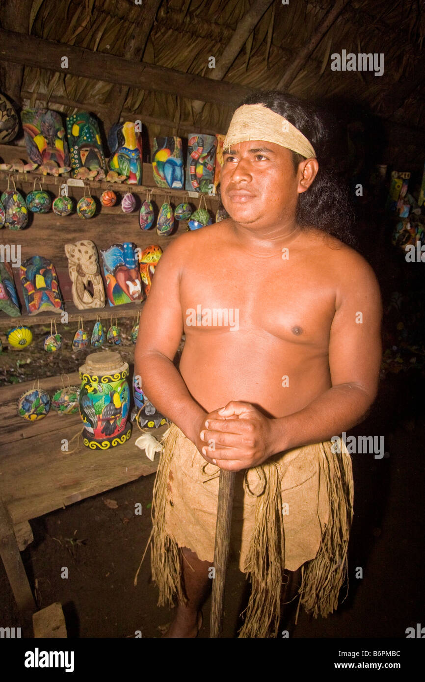 Local native shows off crafts made by members of his Maleku tribe, an Inca tribe, in rainforest near Arenal Volcano, Costa Rica Stock Photo