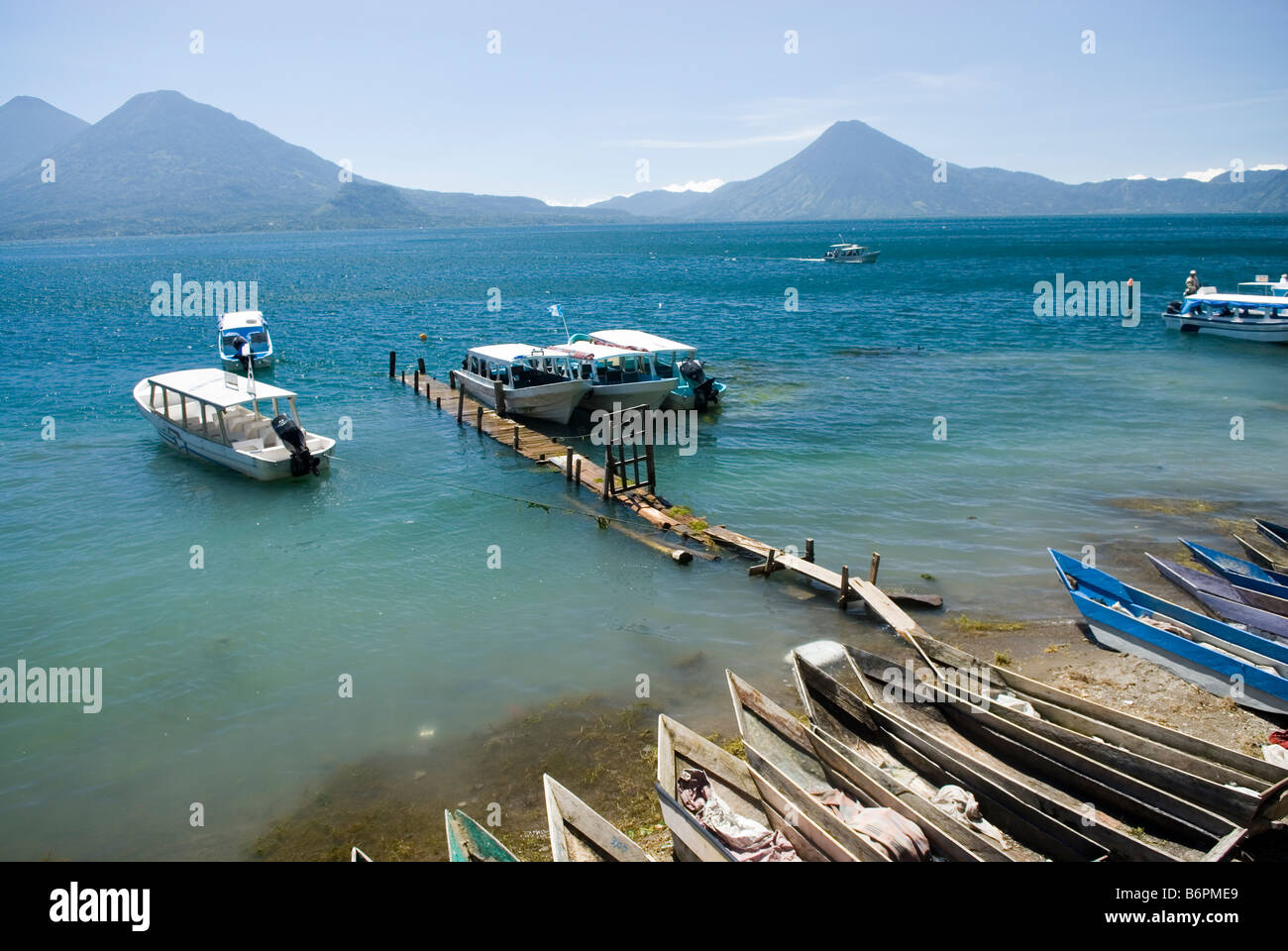 Lago de Atitlan, seen from Santa Catarina Palopo, Guatemala. Volcan Atitlan, -Toliman and -San Pedro on background. Stock Photo