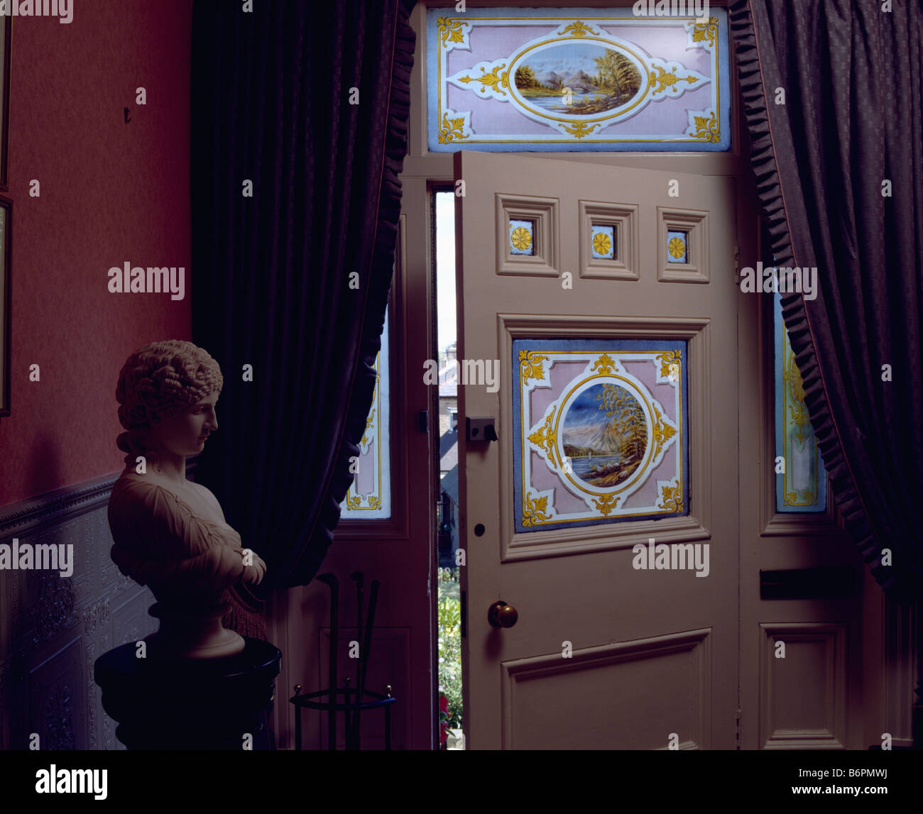 Stained glass panel above front door with stained glass panel in