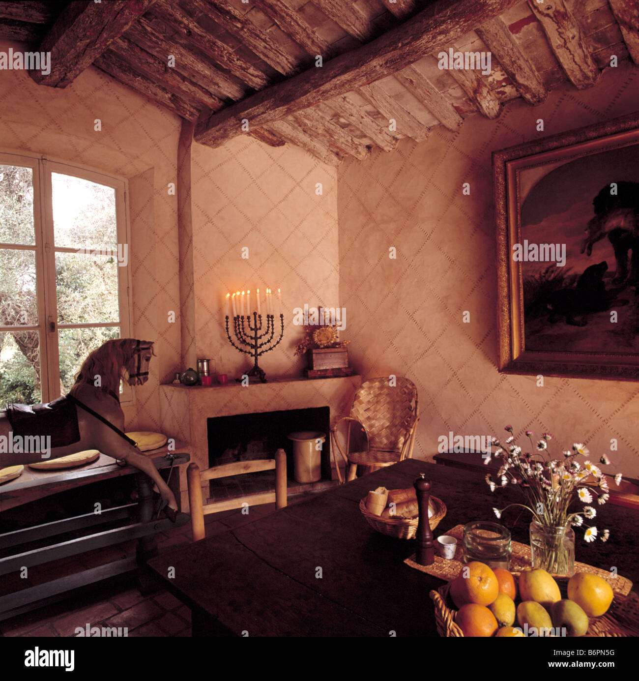 Rocking Horse In Front Of Dining Room With Rustic Beamed Ceiling
