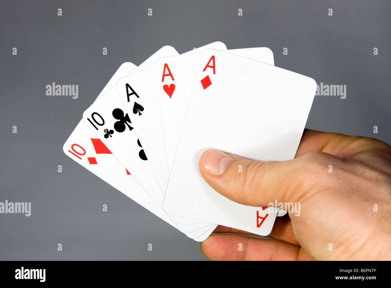 Hand with poker cards. Full house. Stock Photo