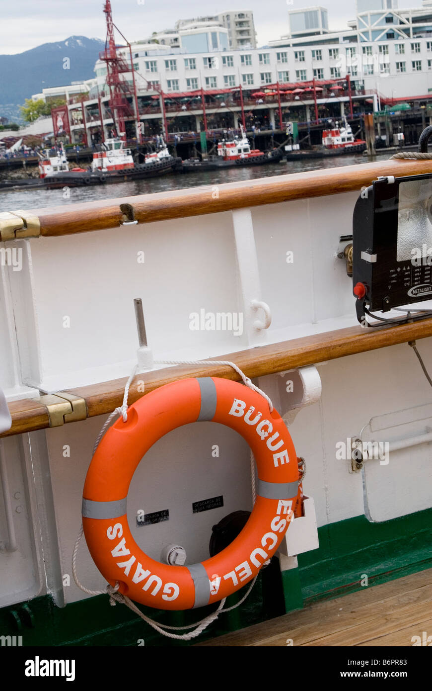 Life preserver on the side of a docked boat Stock Photo