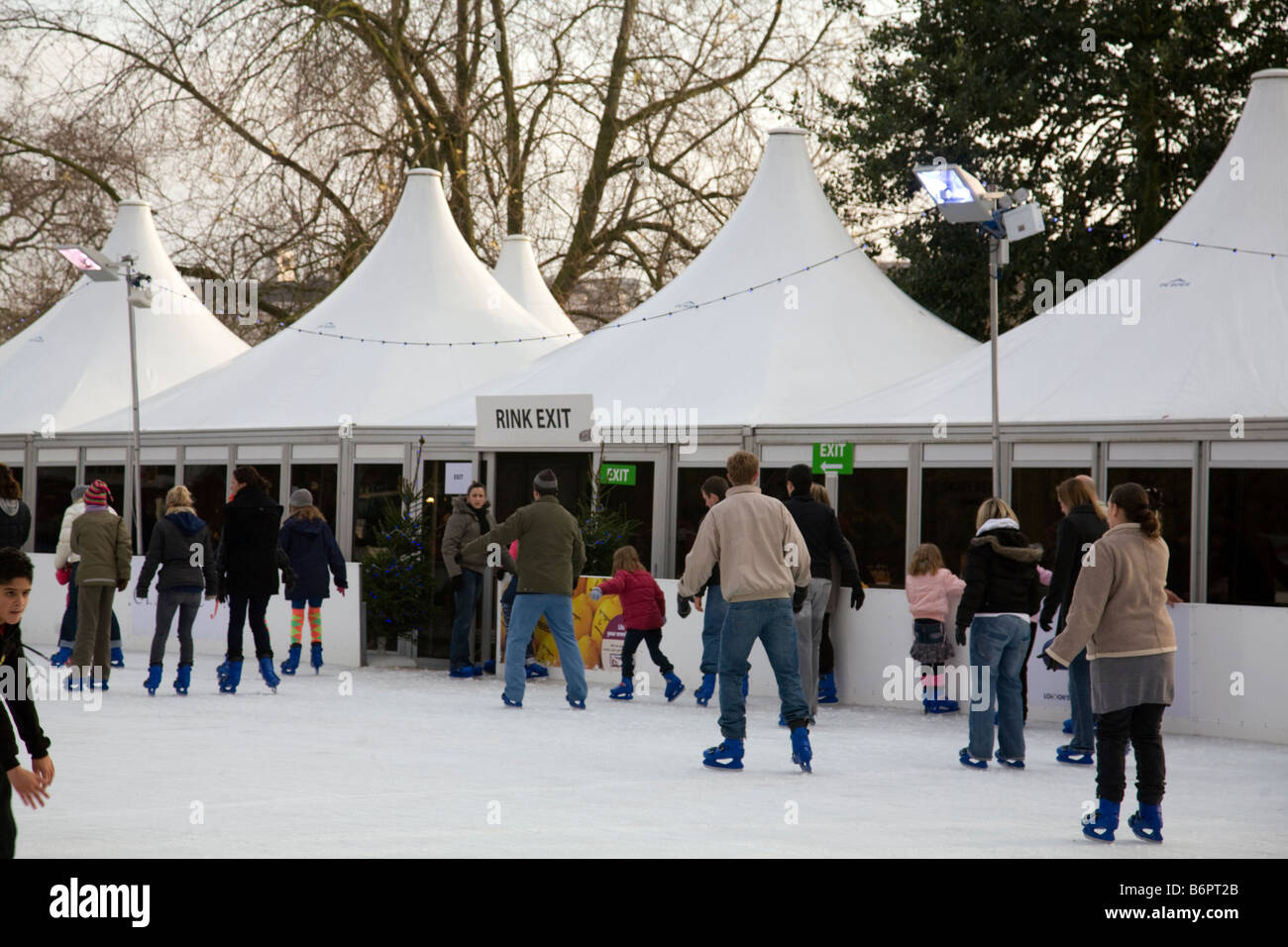 ice skating rink with ice skaters using it at hyde park winter