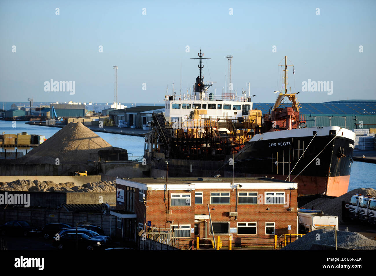 A cargo ship in dock at Shoreham harbour Sussex UK Stock Photo