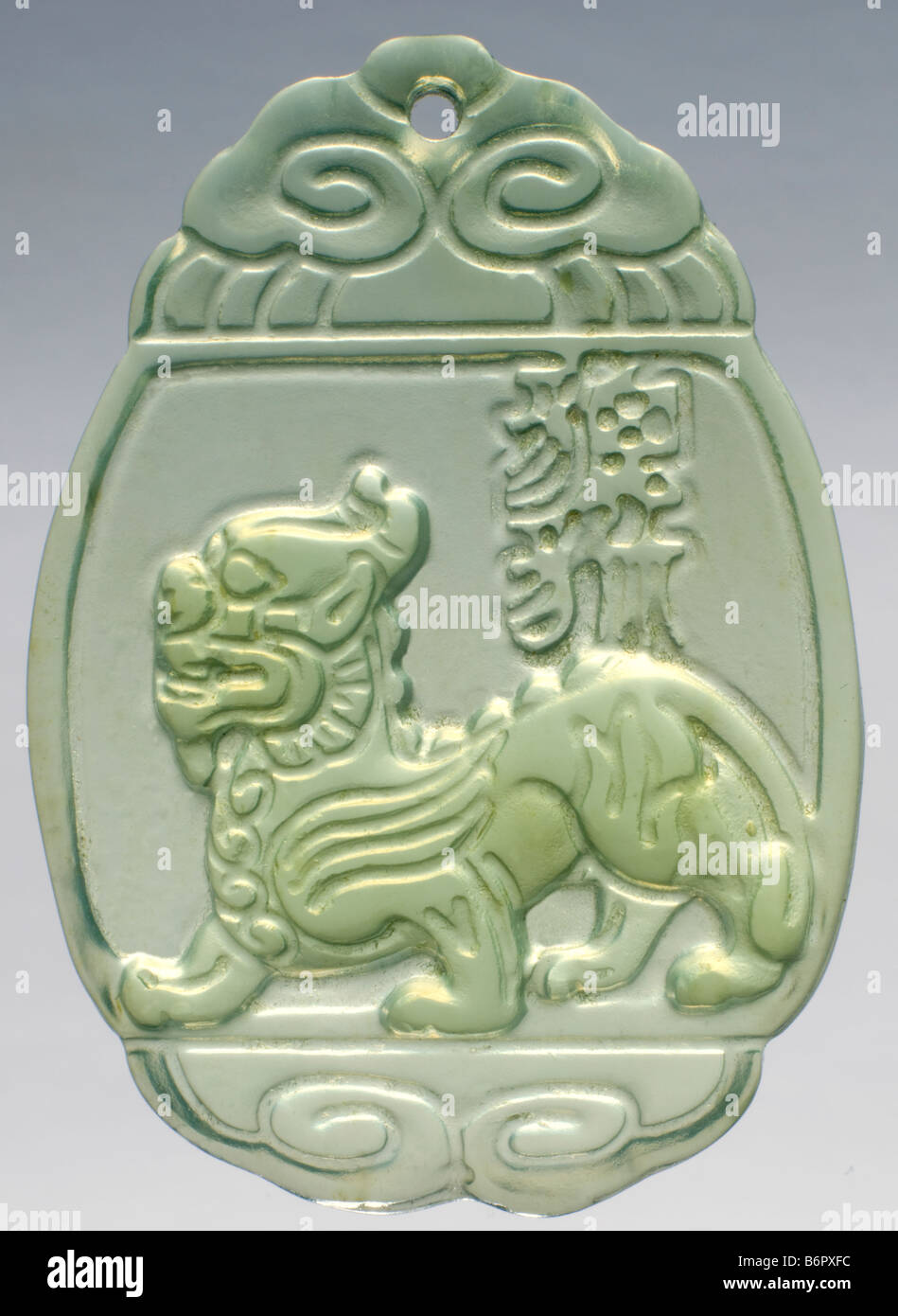 Hand carved Jade pendant with traditional Chinese Lion Stock Photo