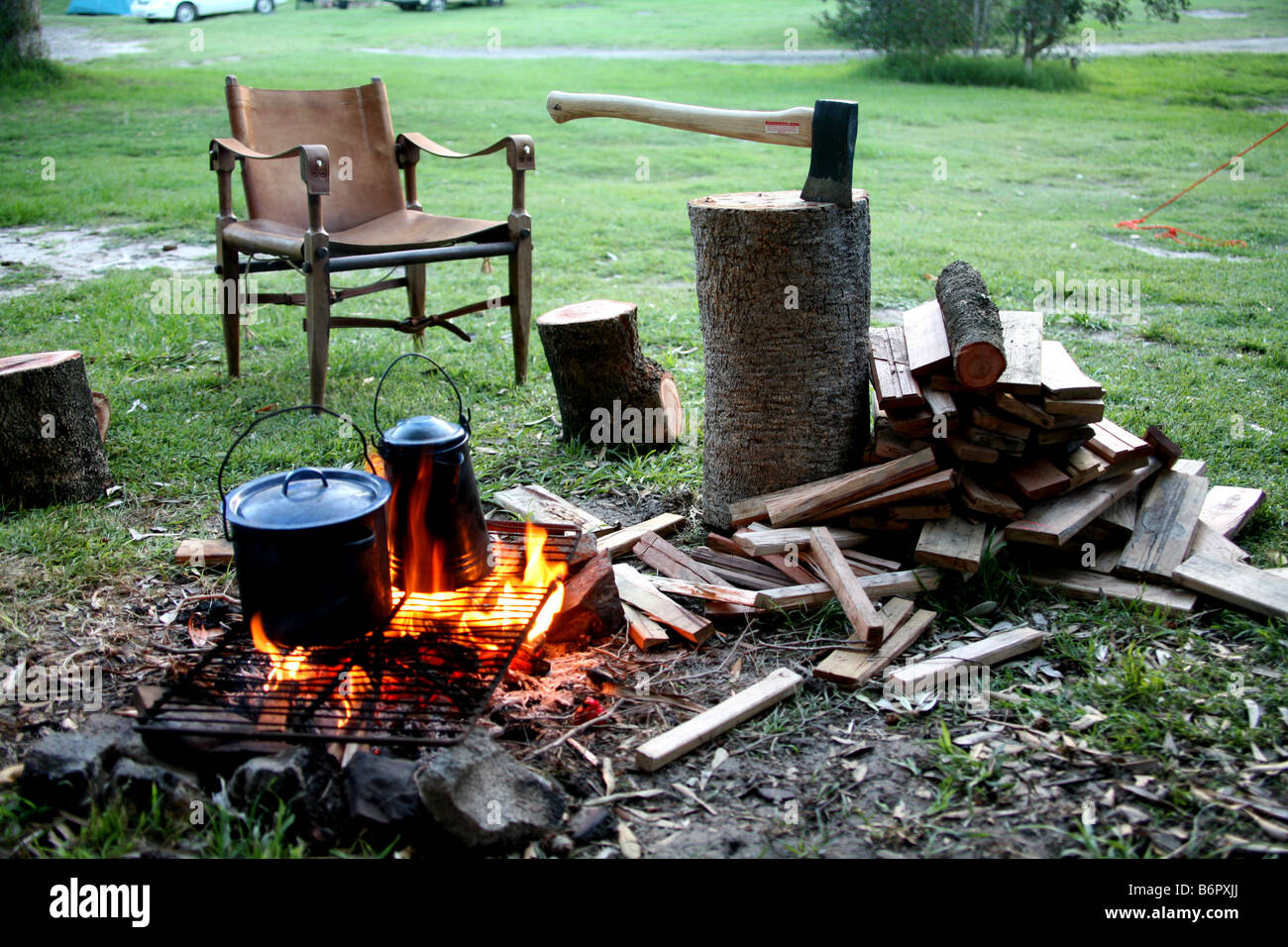 Pots and pans being used for cooking on an open fire outdoors Stock Photo