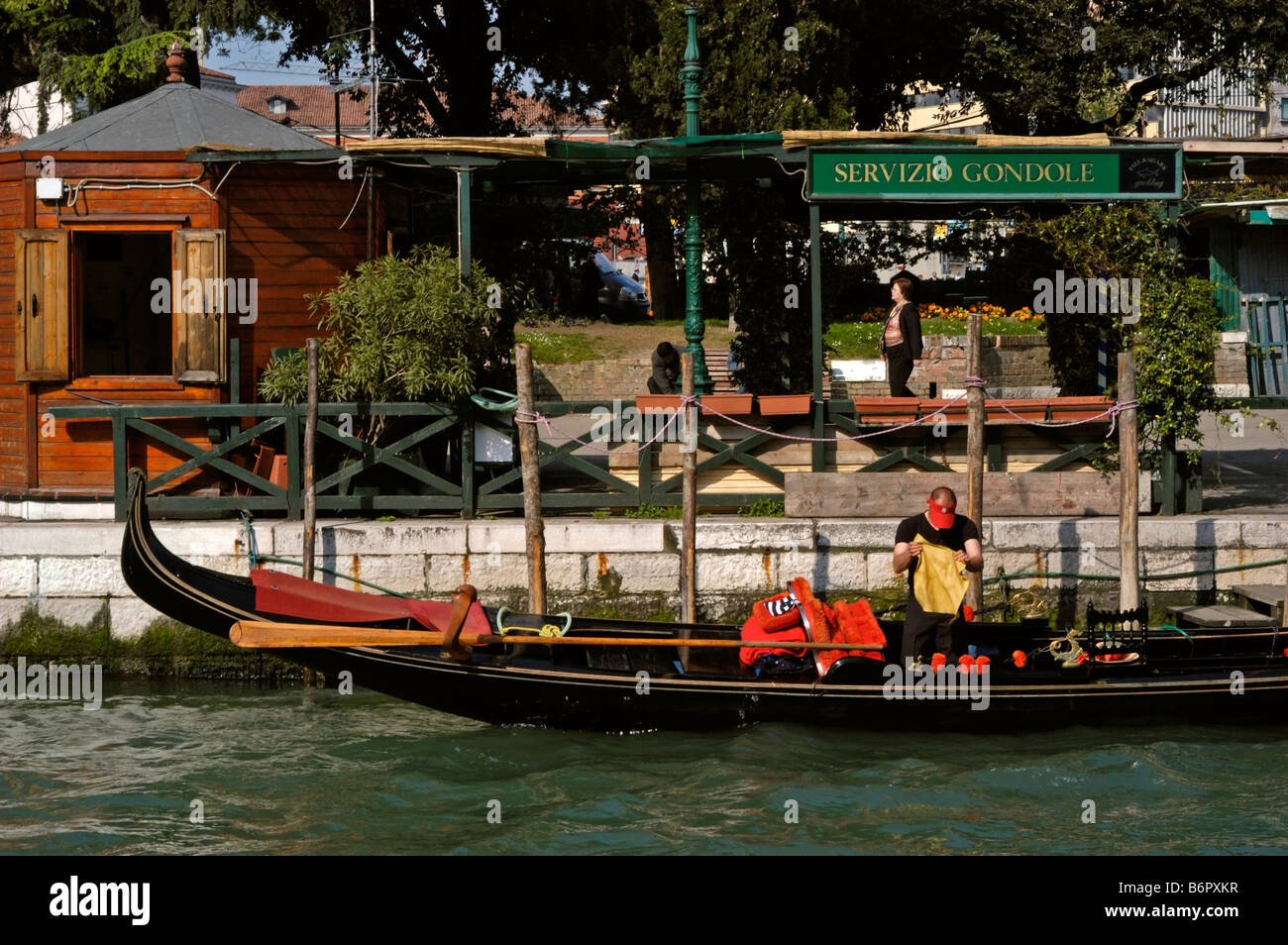 Venice, Veneto, Italy. Gondola service by Piazzale Roma (car park) Gondolier tidying up Stock Photo