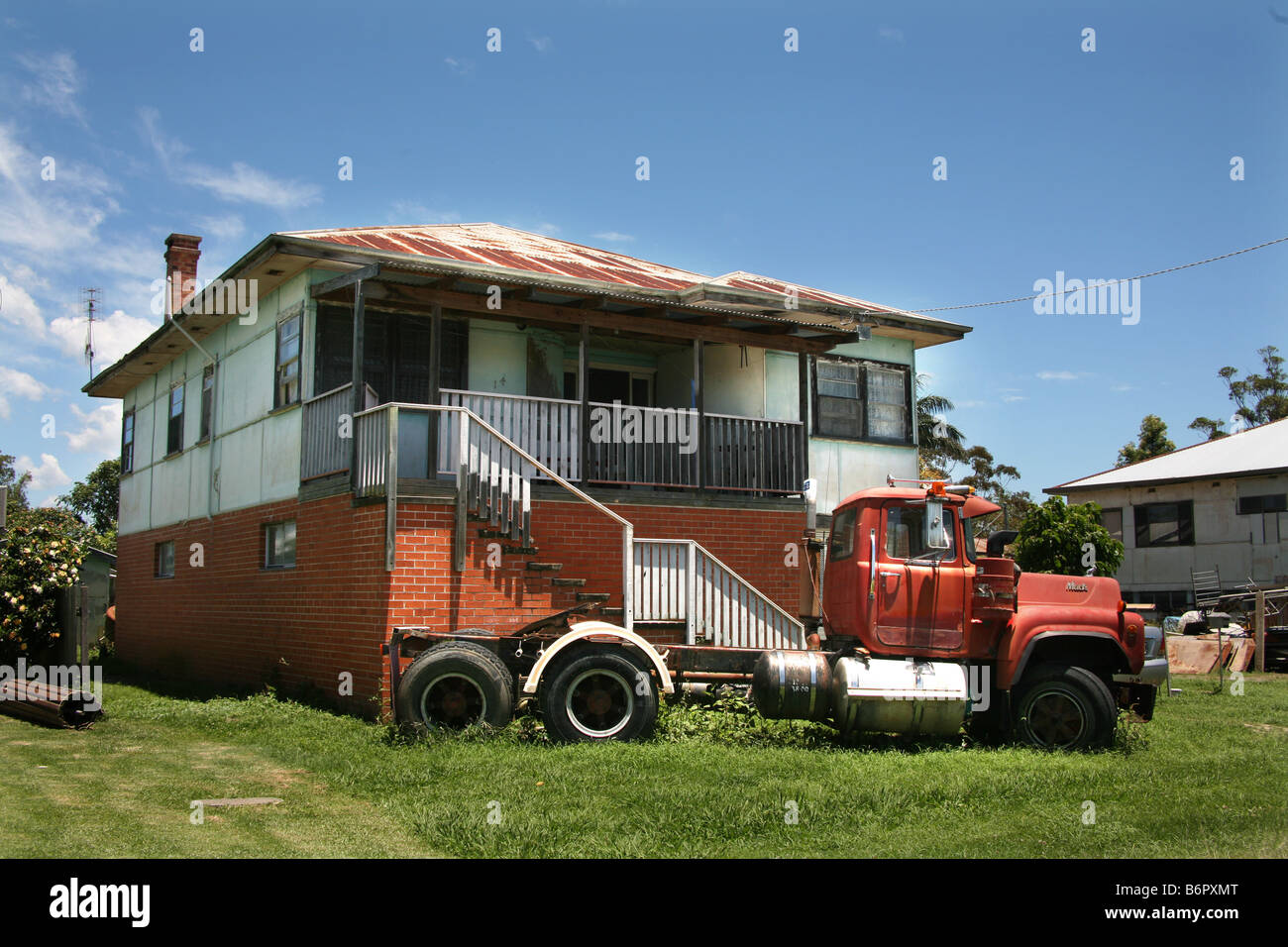 Australian Architecture Smithtown unkempt house with Mac Prime mover on the Macleay river New South Wales Australia Stock Photo