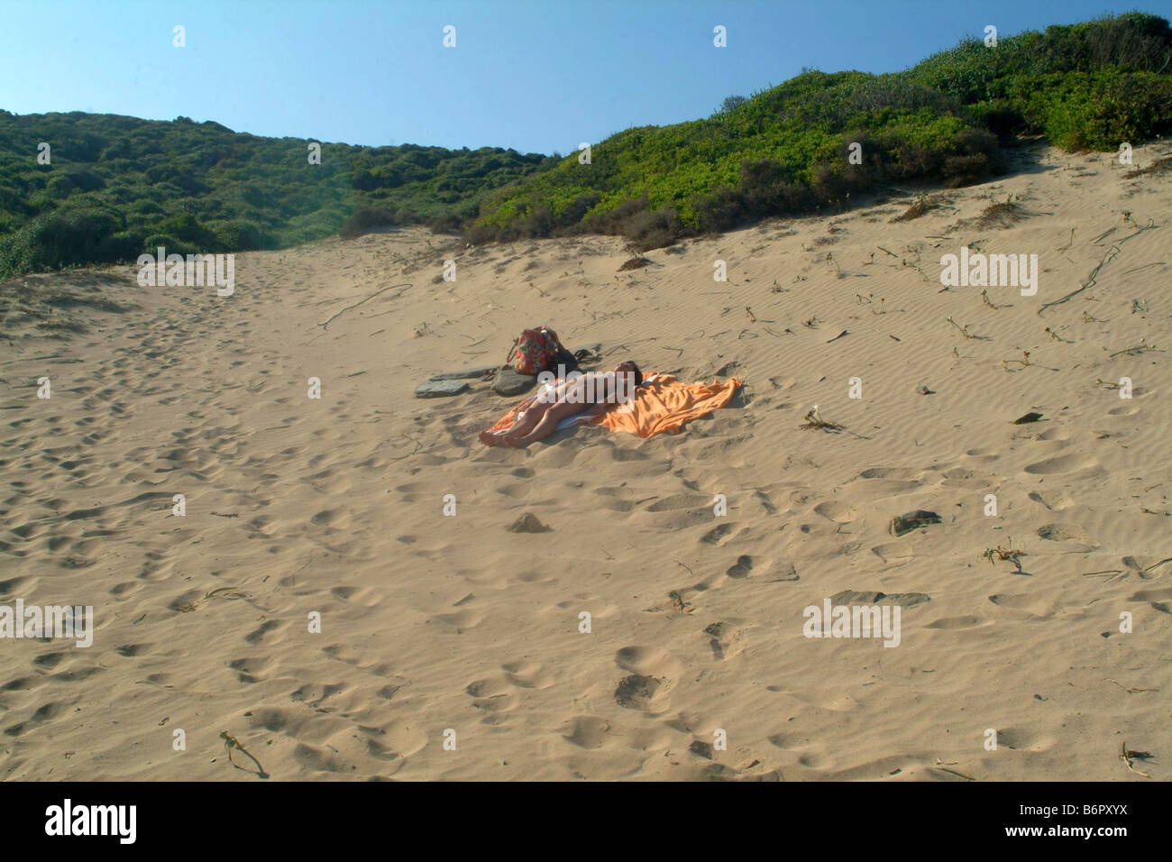 naked woman lying at sandy beach, Spain, Balearen, Majorca Stock Photo - Alamy