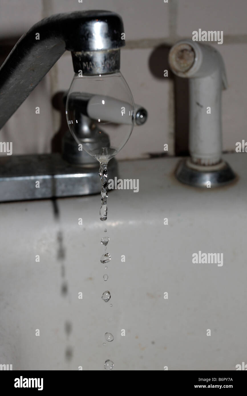 Air bubble formed on spout of water tap Stock Photo Alamy