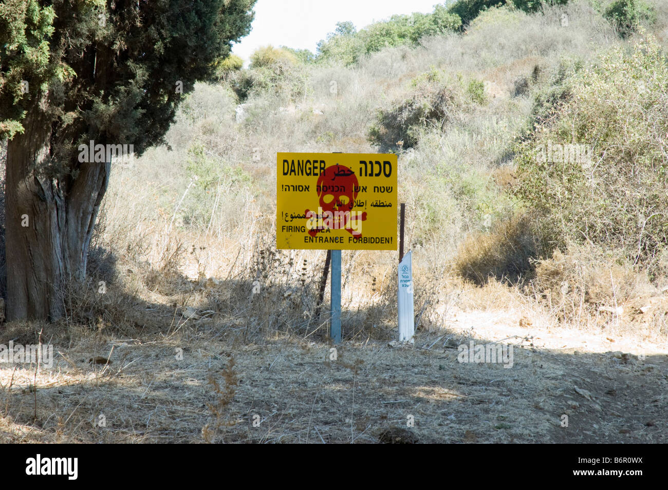 Israel Golan Heights Military firing zone A yellow and red warning sign Stock Photo