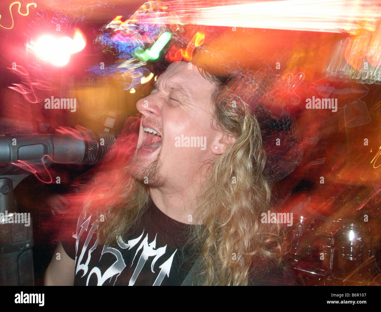 Kevin Lawless of the locally famous Bar band 'Liplock' sings during a show in West Haven Connecticut USA Stock Photo
