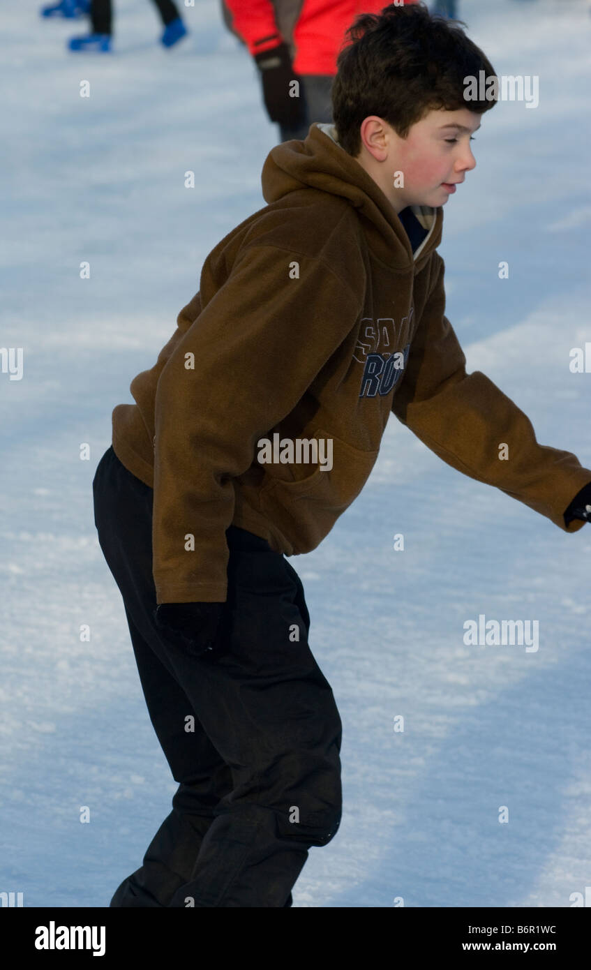 Teenage Boy teenager Ice Skating outdoors Stock Photo