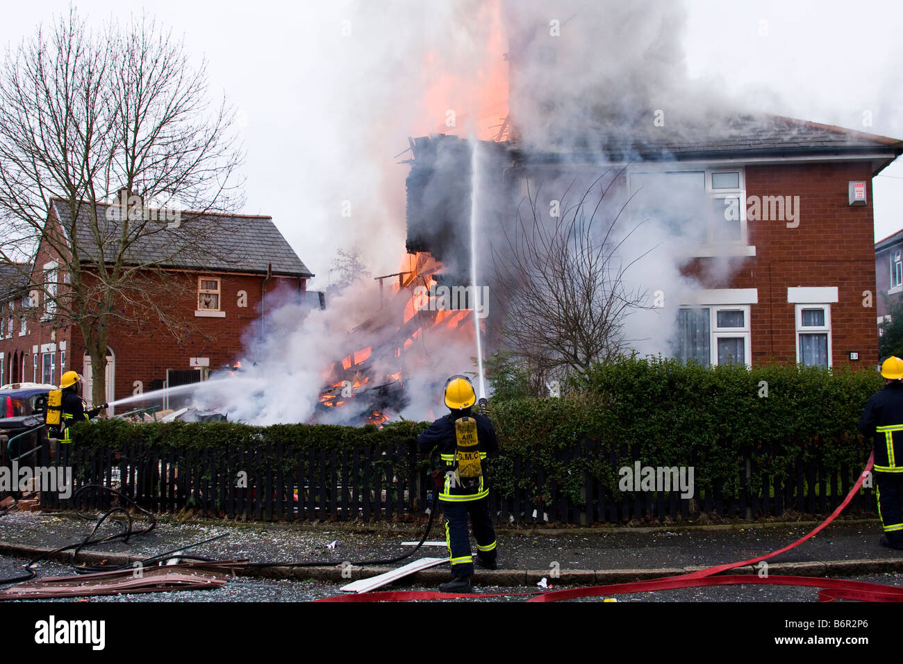 House on fire destroyed in a gas bottle explosion firemen in action