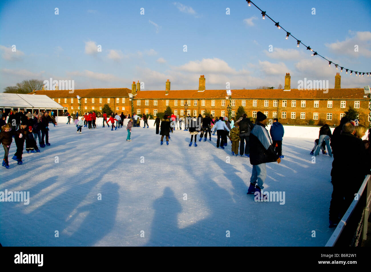 Skaters at Hampton Court Palace Outdoor xmas Ice Skating Rink Stock