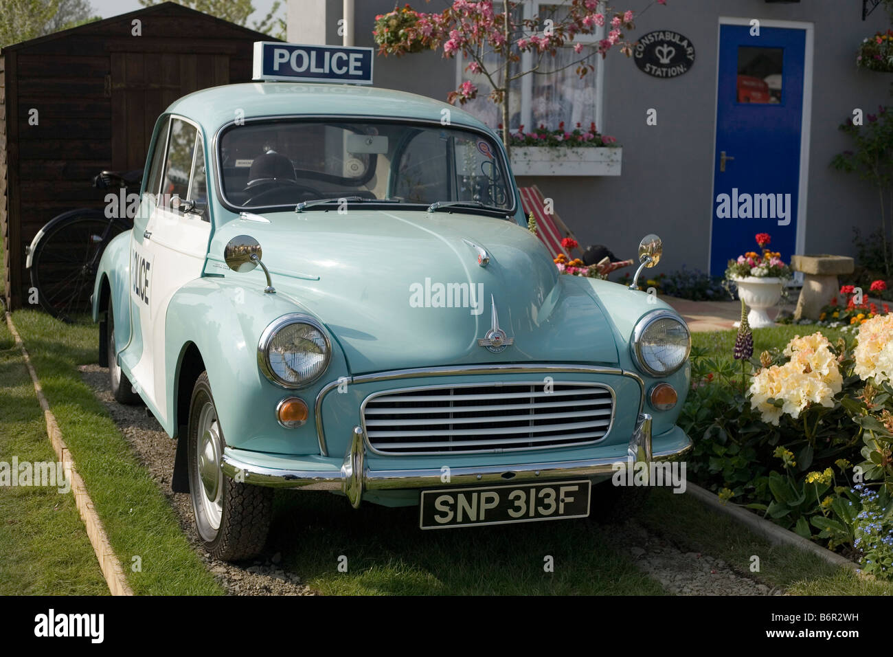 Morris Minor in show garden at Malvern Spring Flower Show 2008 Stock Photo