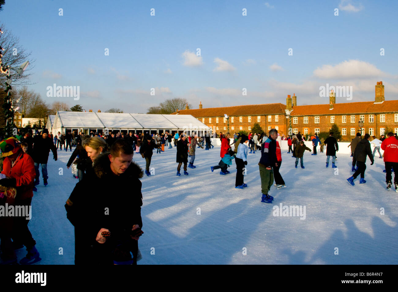 Skaters at Hampton Court Palace Outdoor xmas Ice Skating Rink Stock