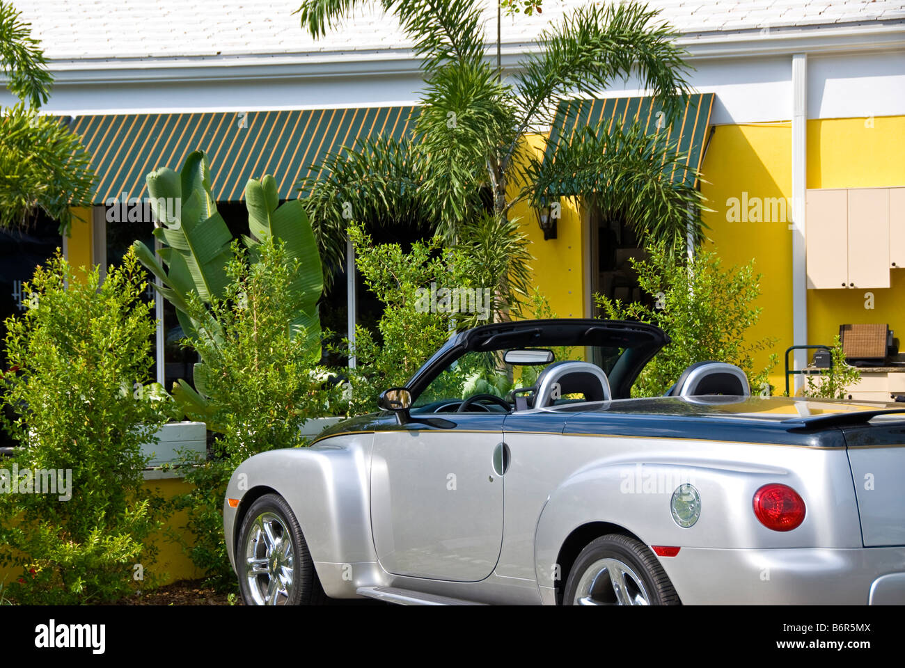 Silver Convertible car auto top down 3rd st s Third Street South Naples Florida Fl chic shopping area Stock Photo