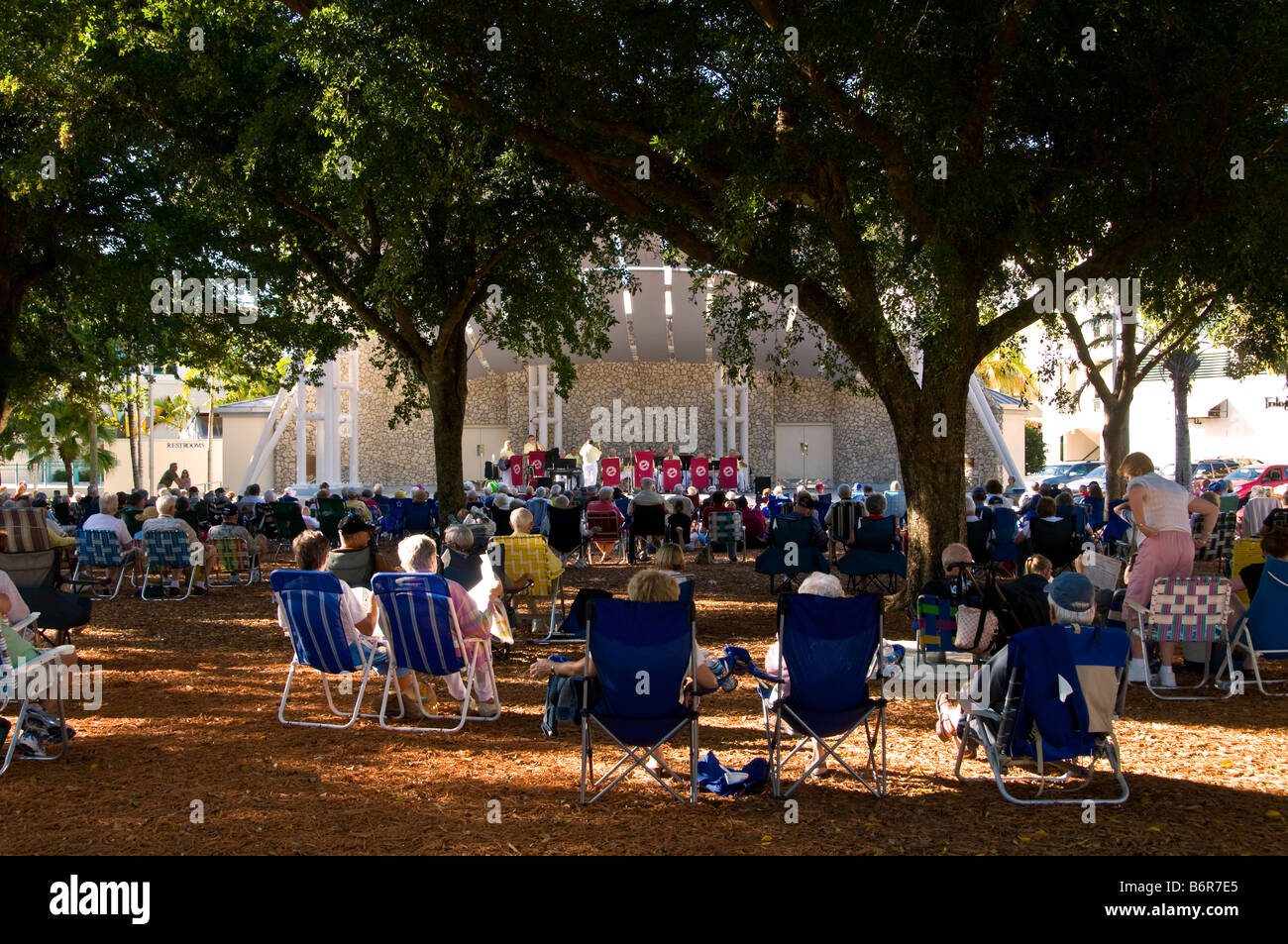Outdoor Concert in the Park Naples Florida fl december winter vacation crowd chairs bandshell Stock Photo