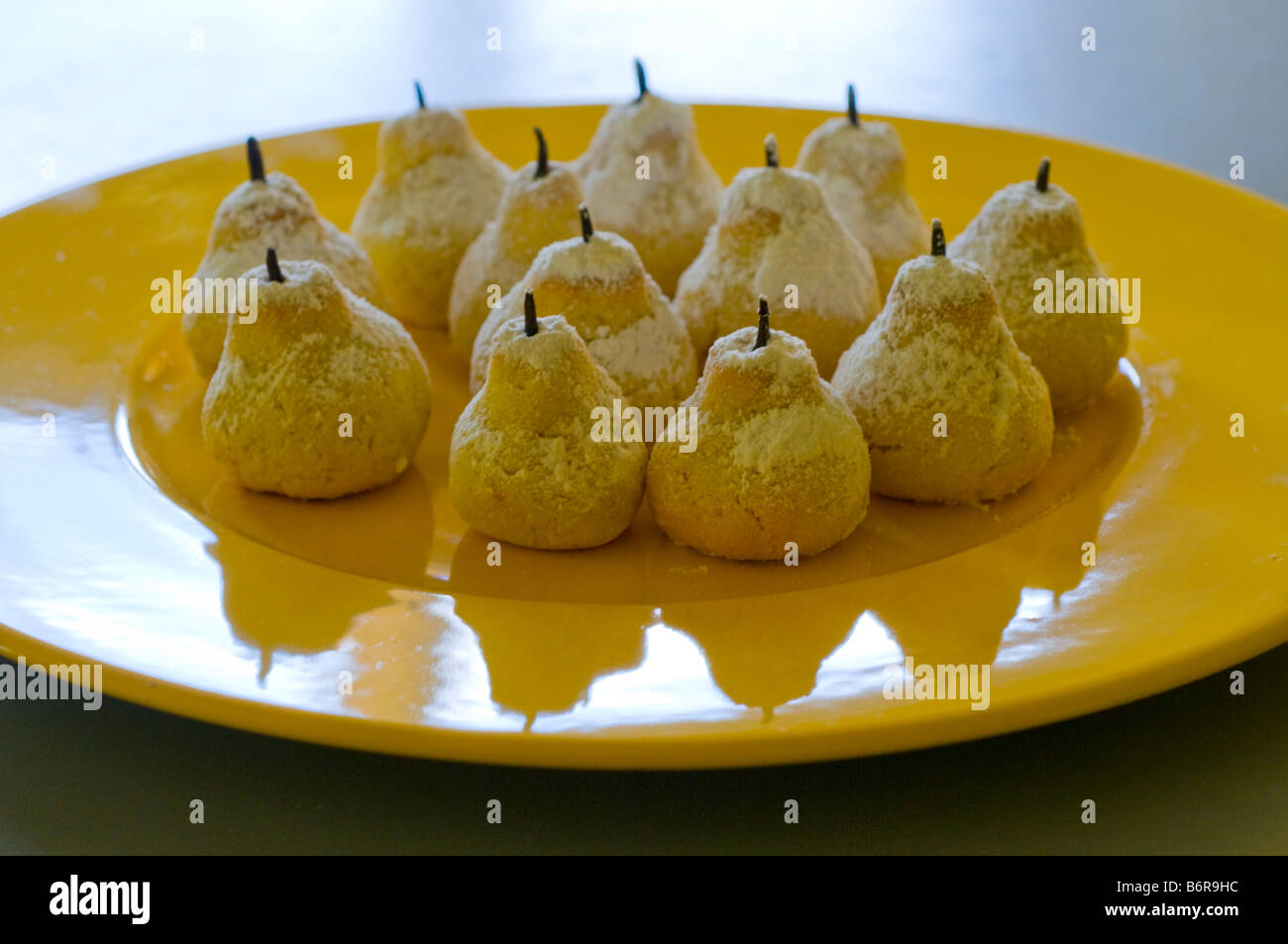 A platter of Amigthalota Greek pastries in the shape of little almond flavoured pears Stock Photo
