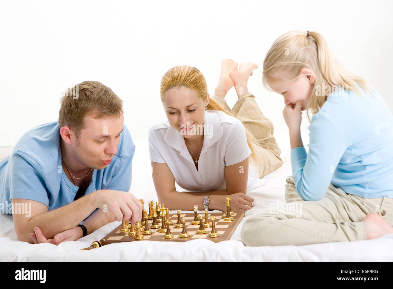 Portrait of family playing chess seriously portrait Stock Photo