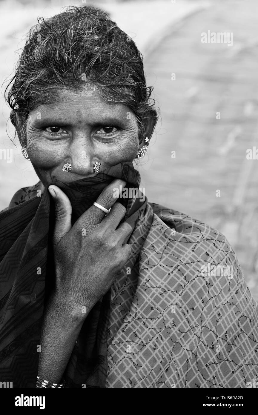 Poor indian woman staring into camera black and white Stock Photo