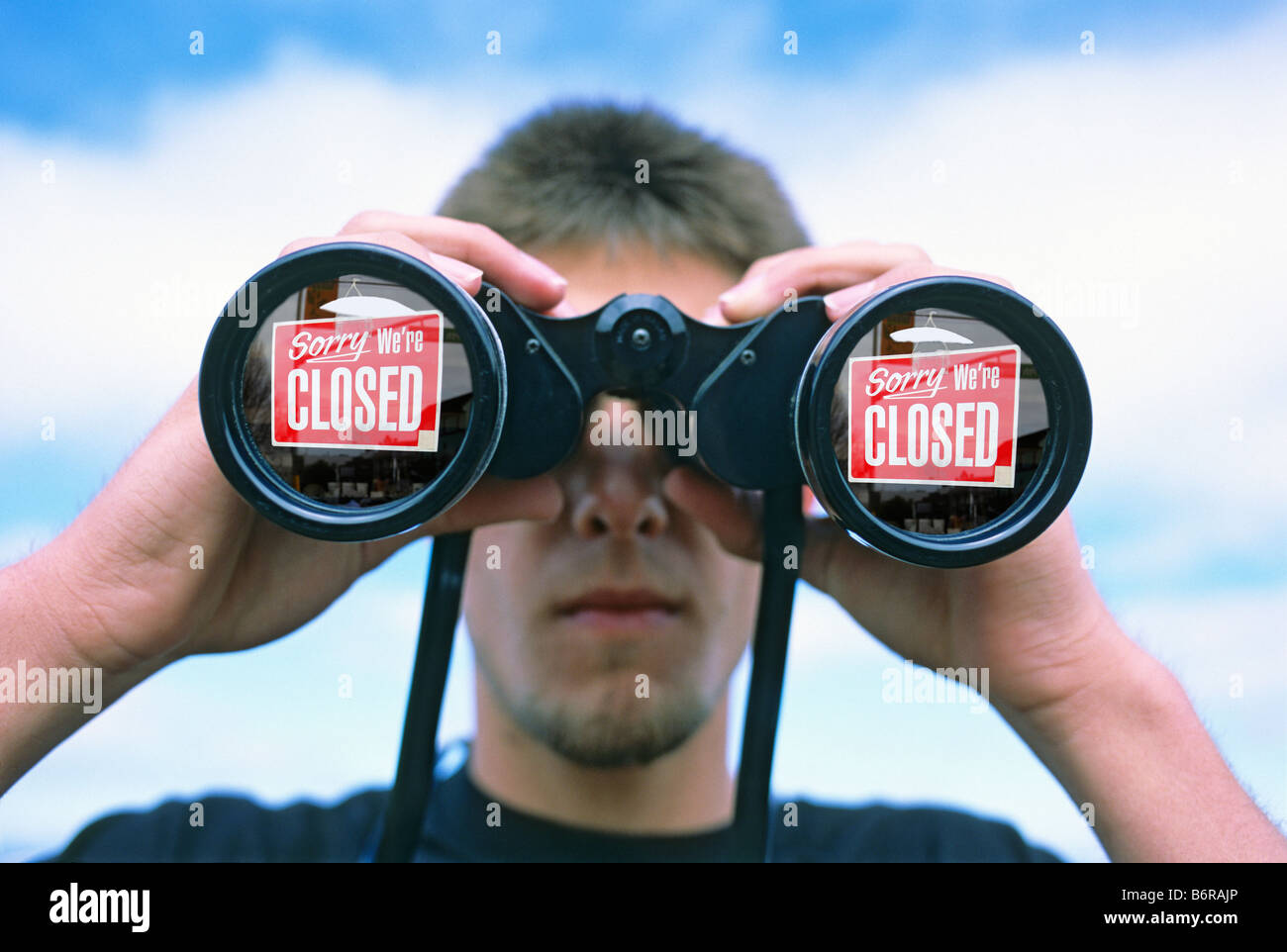 teenage boy looking through binoculars Stock Photo