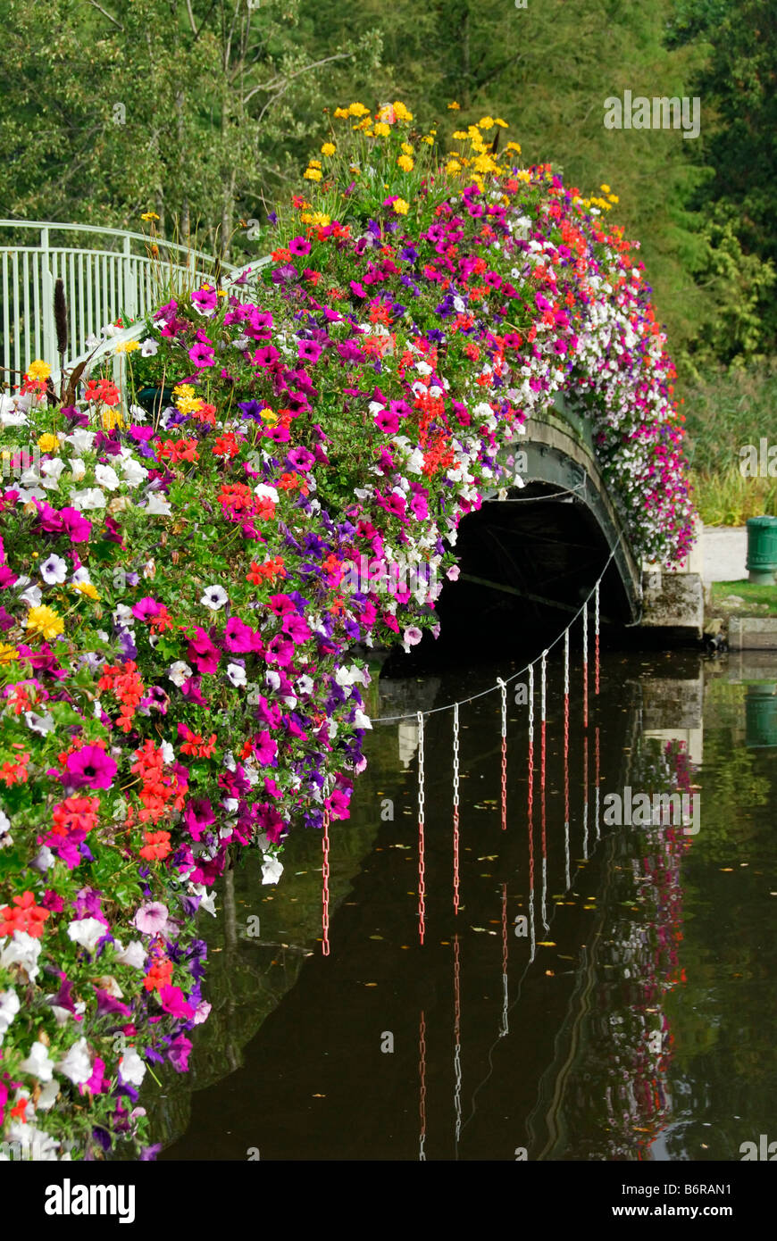 floral display on bridge over the lake, Bagnoles de l'Orne, Normandy, France Stock Photo