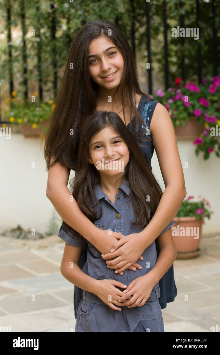 Two sisters hugging Stock Photo