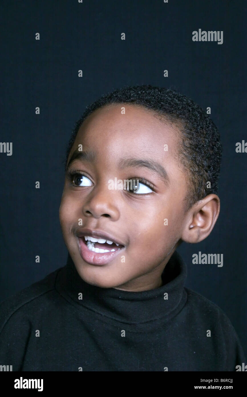 Thoughtful and cute African American boy Stock Photo - Alamy