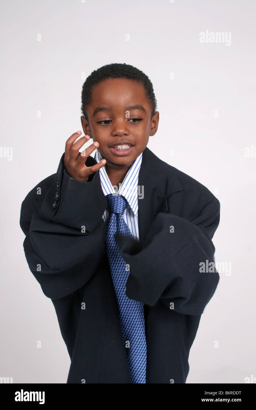 Young boy dressed up like a businessman Stock Photo