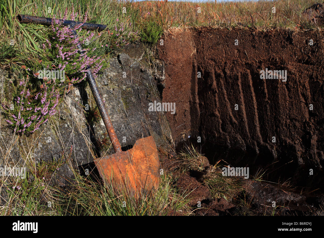 Peat cutting, spade, Isle of Islay, Scotland. Peat is used as a winter fuel. Stock Photo