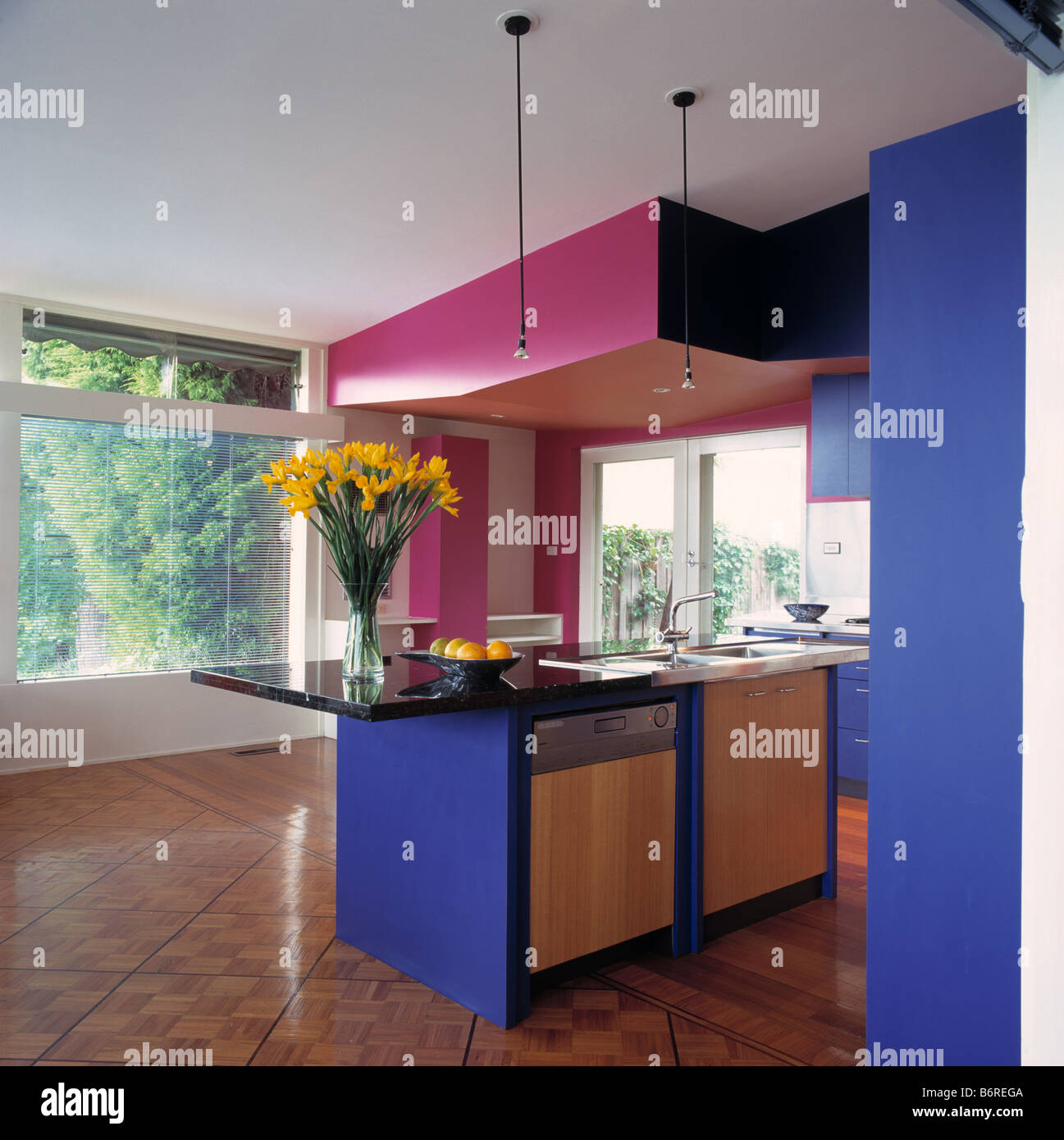 Bright Pink False Ceiling Above Fitted Dishwasher And Fridge