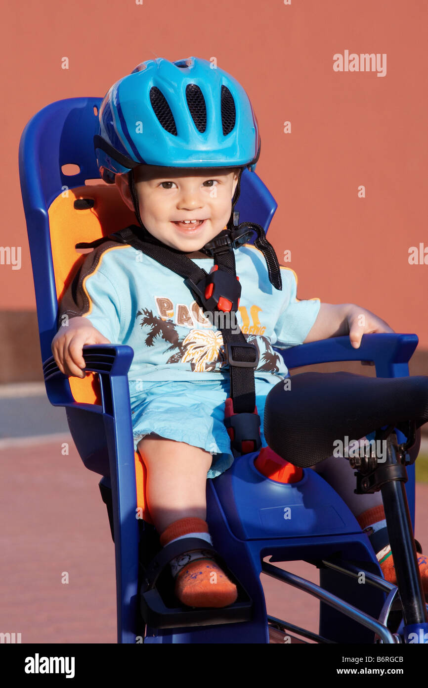 happy baby in bicycle chair Stock Photo Alamy