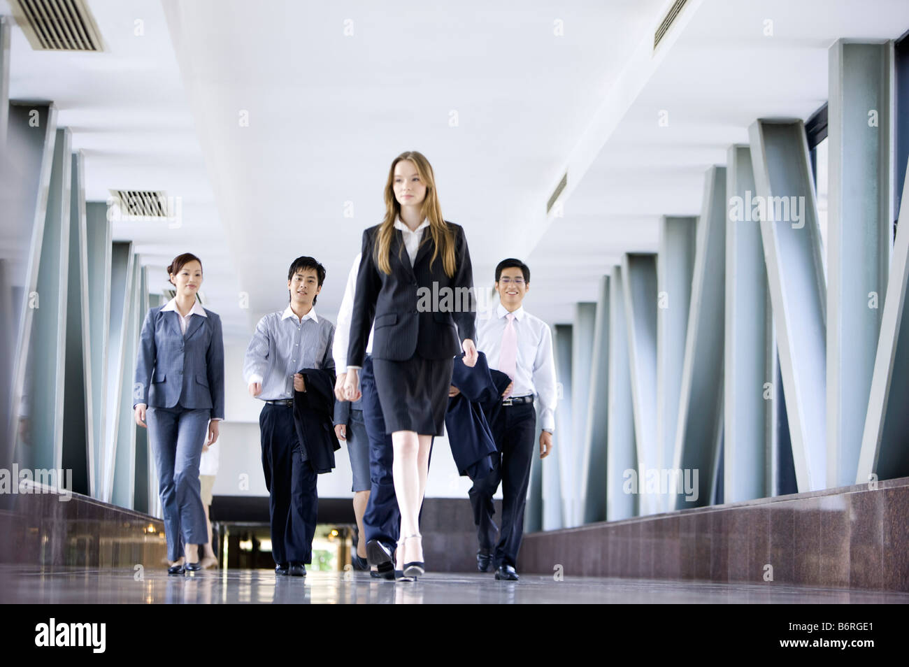 Business people walking in the office building Stock Photo