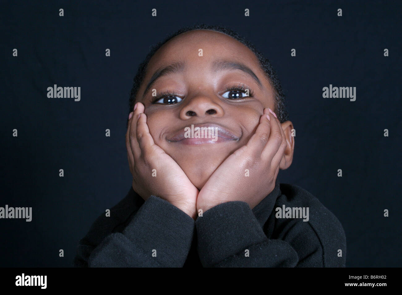 Thoughtful and cute African American boy Stock Photo - Alamy