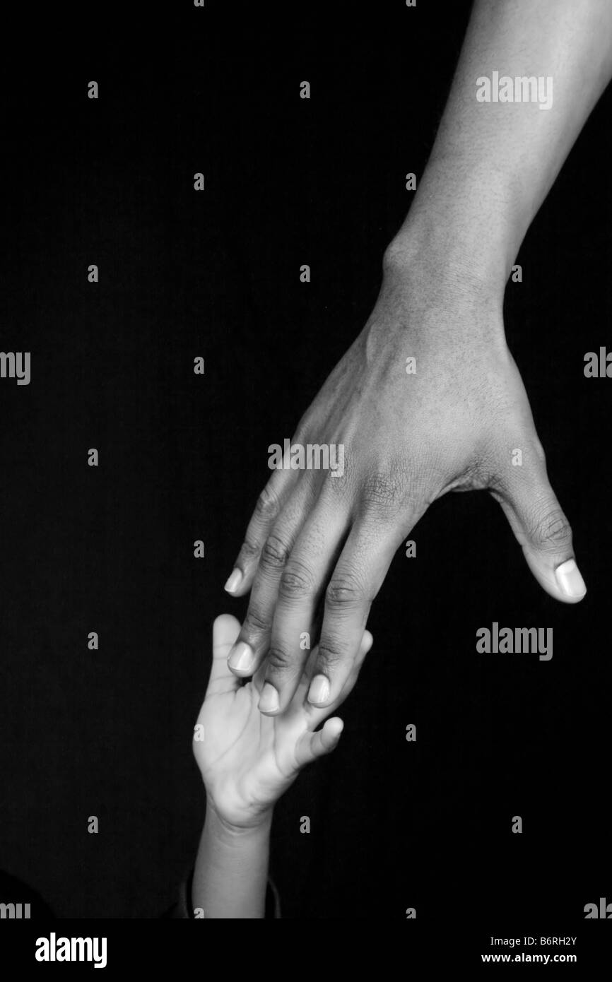 African holding hands help Black and White Stock Photos & Images - Alamy